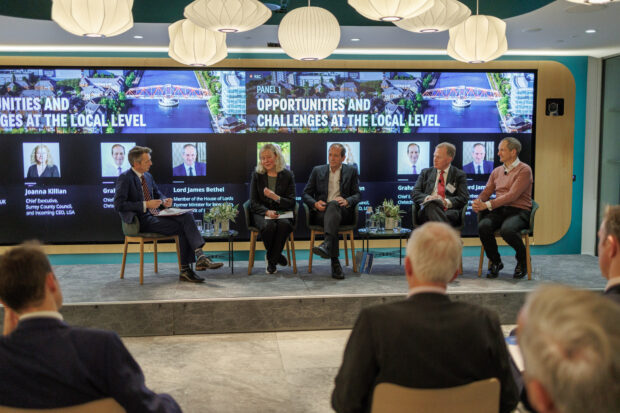 An image of Panel members discussing the report at the launch event.